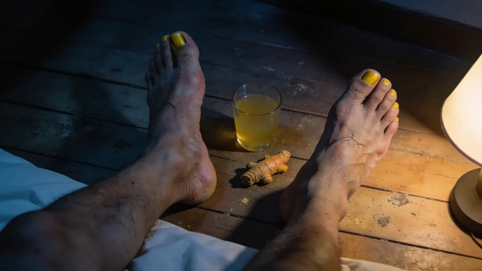 A pair of feet at the end of the day, next to the root behind the homemade drink